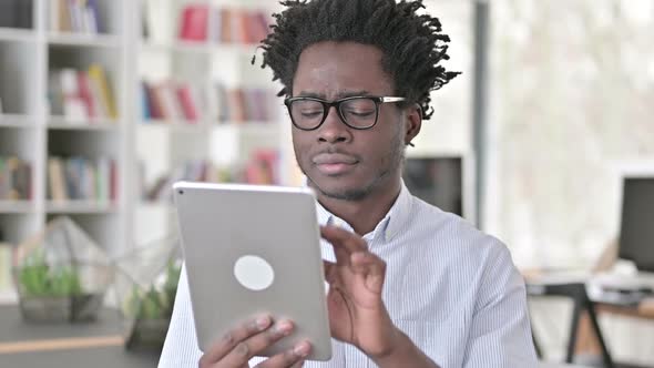 African Man Using Digital Tablet