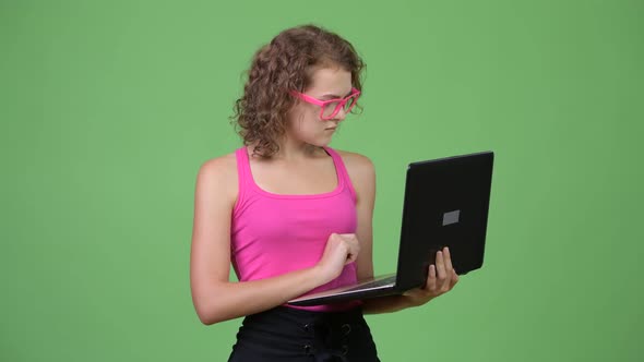 Young Happy Beautiful Nerd Woman Thinking While Using Laptop