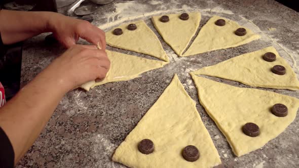 woman twisting pieces and prepare croissant