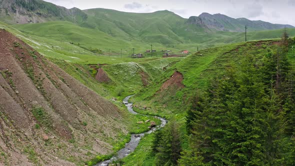 Aerial View Of Canyon With Winding River In Mountain Countryside Of Georgia