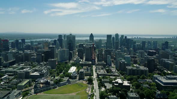 4K Cinematic urban drone footage of an aerial view of buildings and skyscrapers in the middle of dow