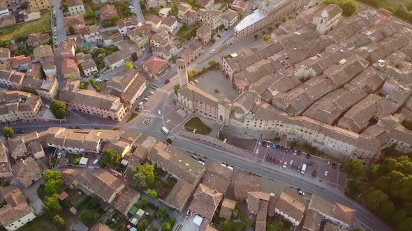 Drone shot of an old historical city during a sunset.