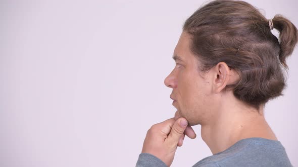 Head Shot Profile View of Handsome Man Thinking