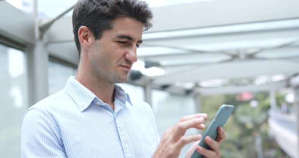 Man use of mobile phone in Hong Kong city