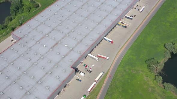 Big Distribution Warehouse Gates Loads Trucks Reversing Loading Dock Aerial