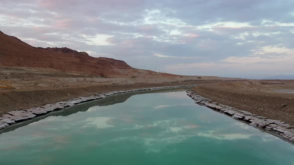 Israel, Turkiz color channel of water by the Deadsea, Low fly shot by drone, close-up