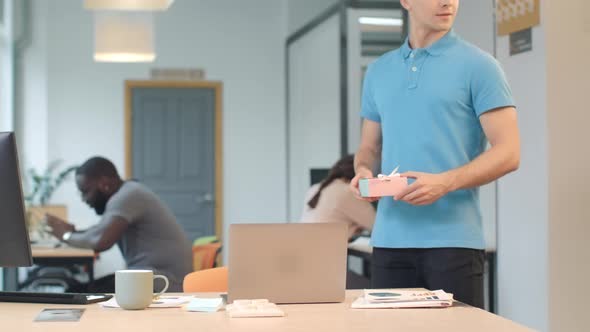 Romantic Man Leaving Gift at Co-working