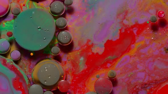 Ink Bubbles Mixed with Liquid Substance of Oil Milk Soap Bright Acrylic Paint on Colorful Surface