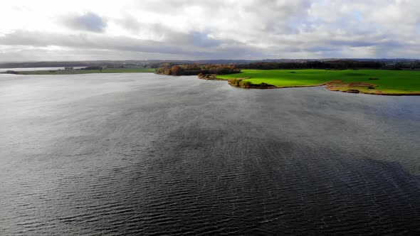 Schlei sea and Northern Germany coastline in strong wind, descending aerial