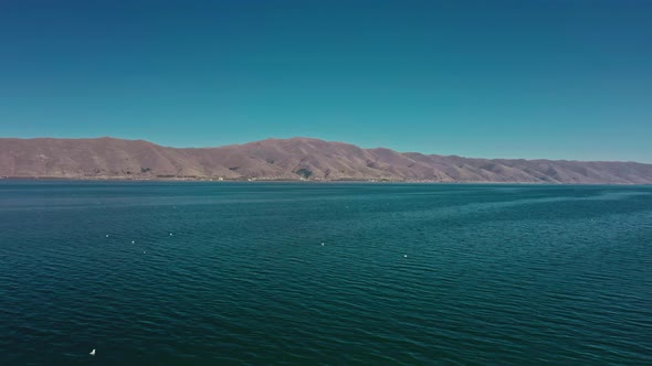 Aerial Drone Shot of Lake Sevan on Background of Mount Ararat