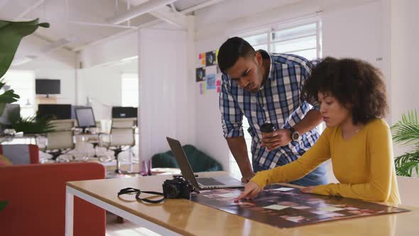 Two colleagues working in creative office