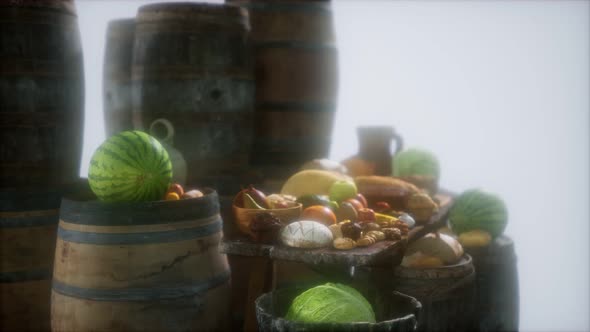 Food Table with Wine Barrels and Some Fruits Vegetables and Bread alt