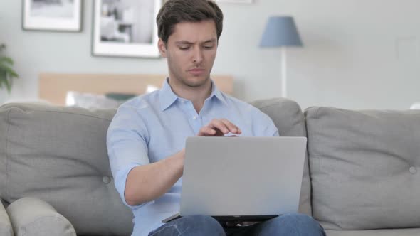 Handsome Young Man Leaving Creative Workplace After Completing Work