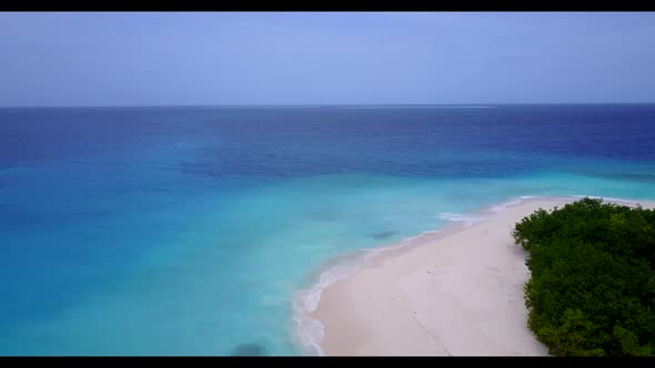 Aerial drone travel of idyllic coastline beach holiday by aqua blue lagoon and clean sand background