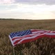 Big Usa Flag Lies on the Ears of Wheat in the Field View From Above - VideoHive Item for Sale