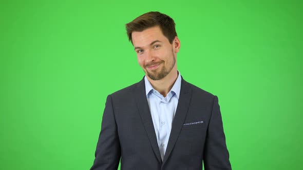 A Businessman Smiles at the Camera and Throws Out His Hands, Unable To Choose From Large Selection