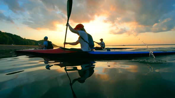 Sunset Waterscape with Racing Boaters