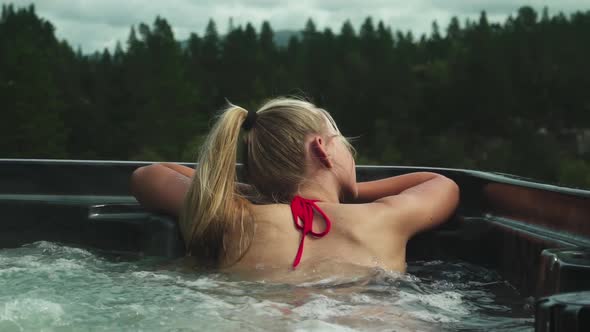 Young Woman Relaxing In Hot Tub