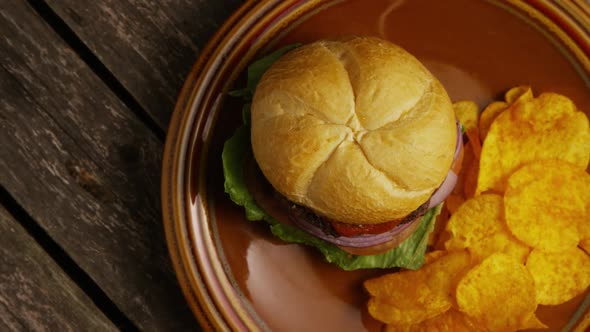 Rotating shot of delicious burger and potato chips - BBQ 155