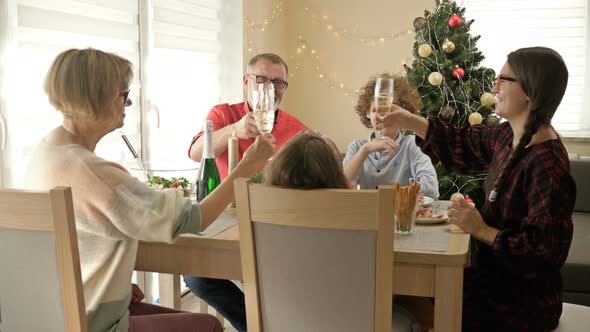 Happy Family Celebrating Christmas Together. Traditional Festive Christmas Dinner in