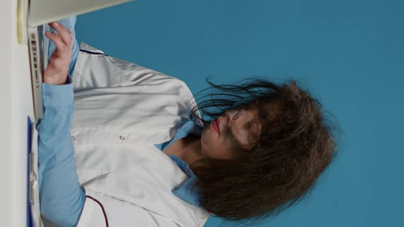 Vertical Video Portrait of Crazy Female Chemist Working on Laptop at Desk