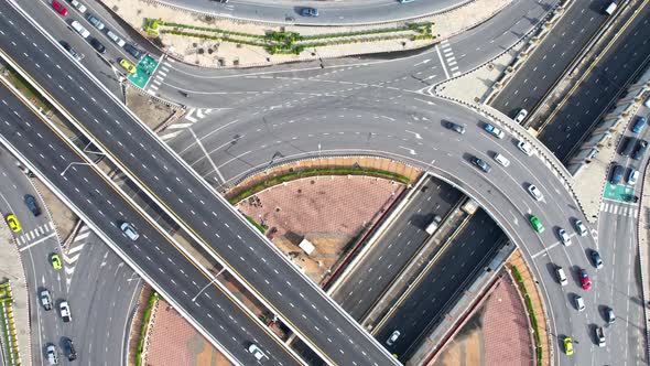 4K : Aerial view shot of fast moving above roundabout