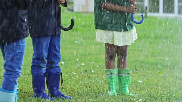 Children Laughing in Heavy Rain