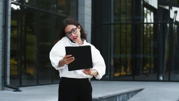 Female in Glasses and Formal Attire