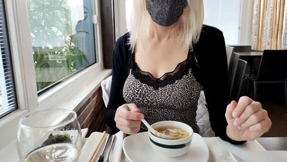 Eating Fish Soup Bowl with Surgical Mask