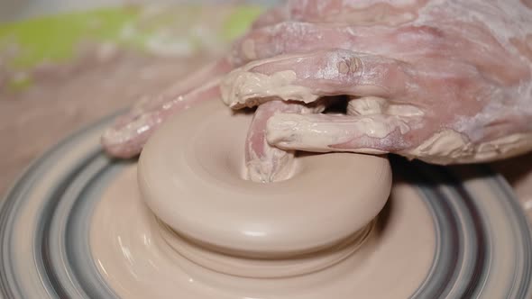 Close Up of Female Potters Hands Making Bowl