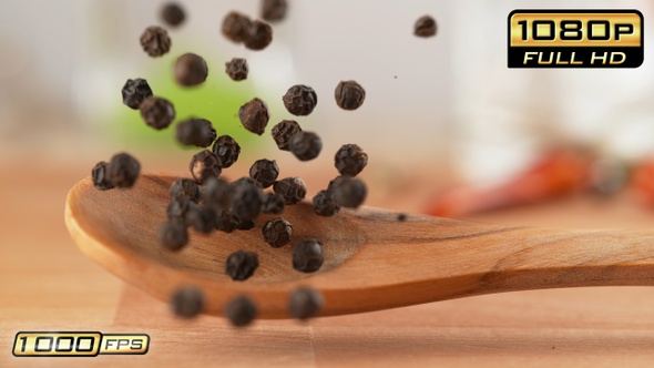 Black Peppercorns on Wooden Spoon