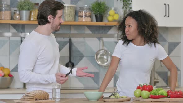 Mixed Race Couple Arguing in Kitchen