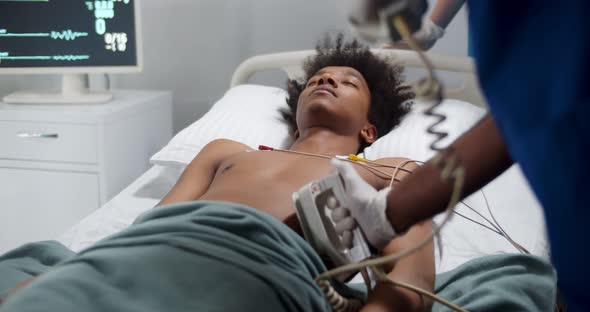 Doctors Give Resuscitation to Afro Male Patient in Emergency Room