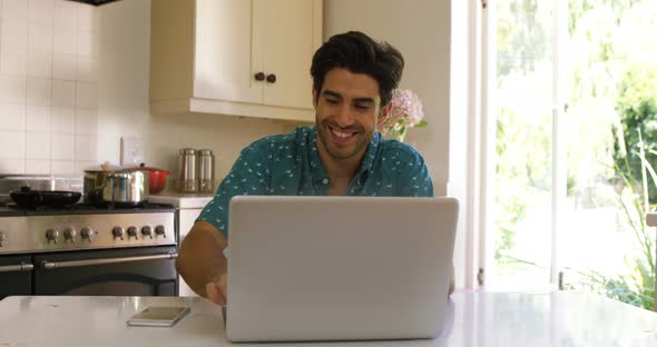 Couple interacting with each other while using digital tablet