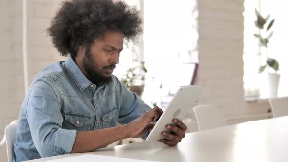 African Man Using Tablet