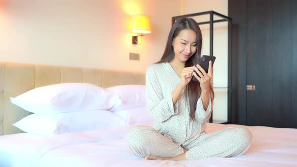 Young asian woman use smart phone