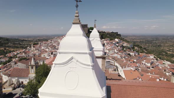 White bell towers of Church Igreja Matriz de Santa Maria da Devesa, Castelo do Vide, Portugal