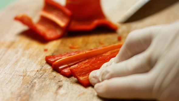 Chef Cut Bell Pepper On Wooden Board With Zucchini