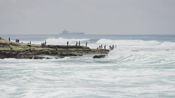 People standing on rocks alt