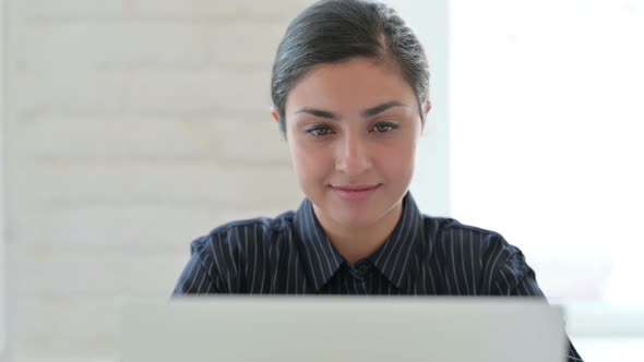 Close Up of Indian Woman Working on Laptop 