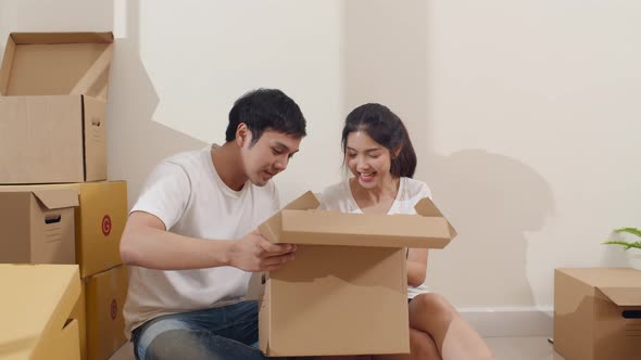 Korean family opening unpacking cardboard boxes and easy and fast service commerce delivery