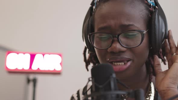 Talented Female African-American Singer Singing in Studio