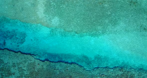 Natural above abstract shot of a paradise sunny white sand beach and blue ocean background in colour