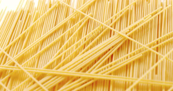 Raw spaghetti on white background