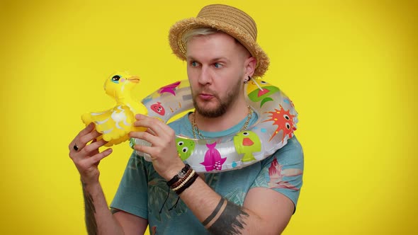 Traveler Tourist Adult Man Dancing Fooling with Swimming Ring and Duck Toy Travel on Weekends