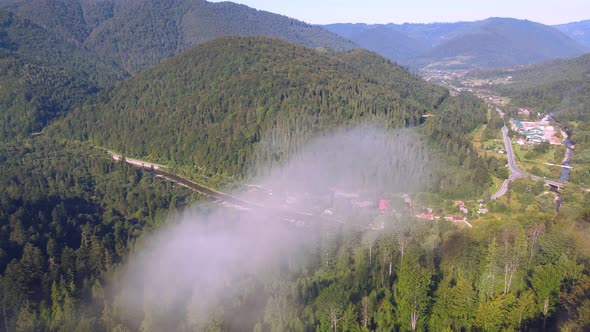 Flight Over the Cloud on Top of the Mountain. A Cloud Formed on Top of a Mountain.