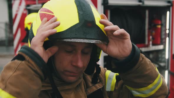 Portrait of the Fireman in Full Uniform and His Colegue in Front of the Fire Truck