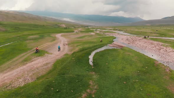 Bicyclist Ride on Assy Mountain Valley in Kazakhstan