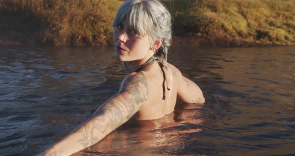 Beautiful Sunlit Woman In Hot Spring