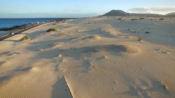 Aerial view of cars on the road of Corralejo Dunes Natural Park in Fuerteventura